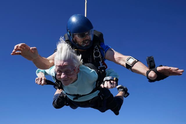 <p>This photo provided by Daniel Wilsey shows Dorothy Hoffner, 104, falling through the air with tandem jumper Derek Baxter on 1 October</p>