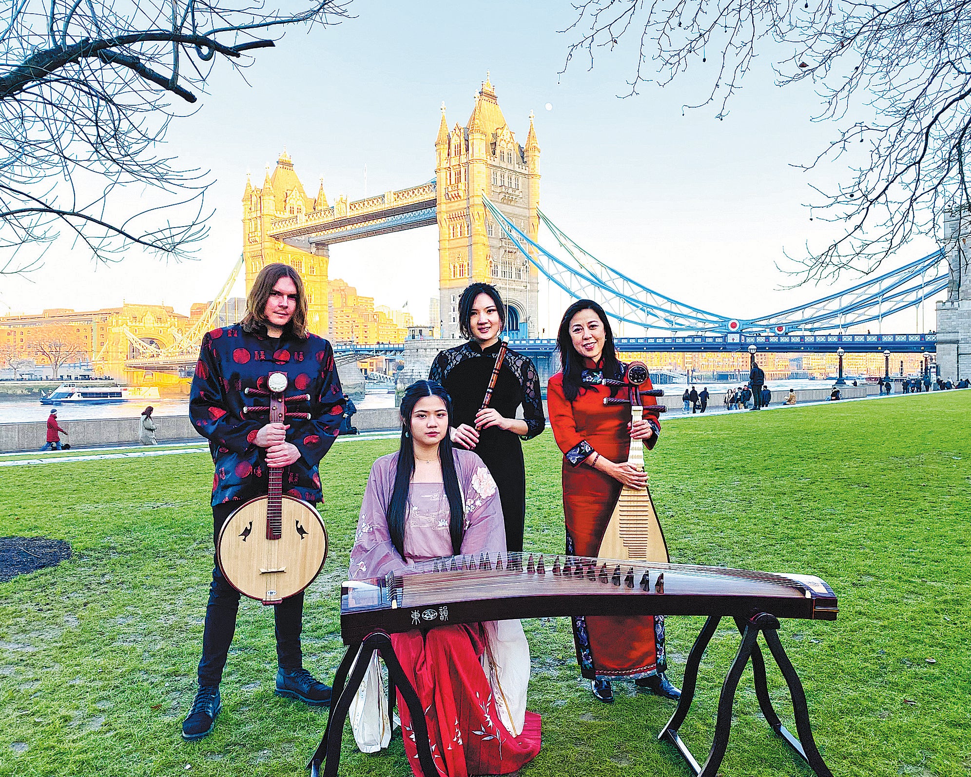 UK Chinese Ensemble members pose in front of London’s Tower Bridge after a performance in 2022