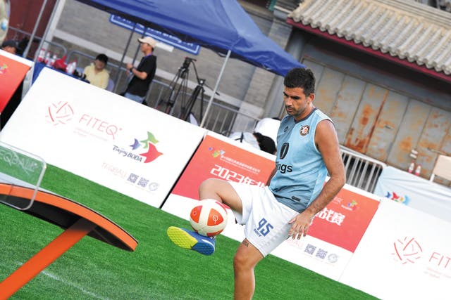 <p>An athlete plays Teqball during the 2023 Beijing Teqball Challenge in August, 2023</p>