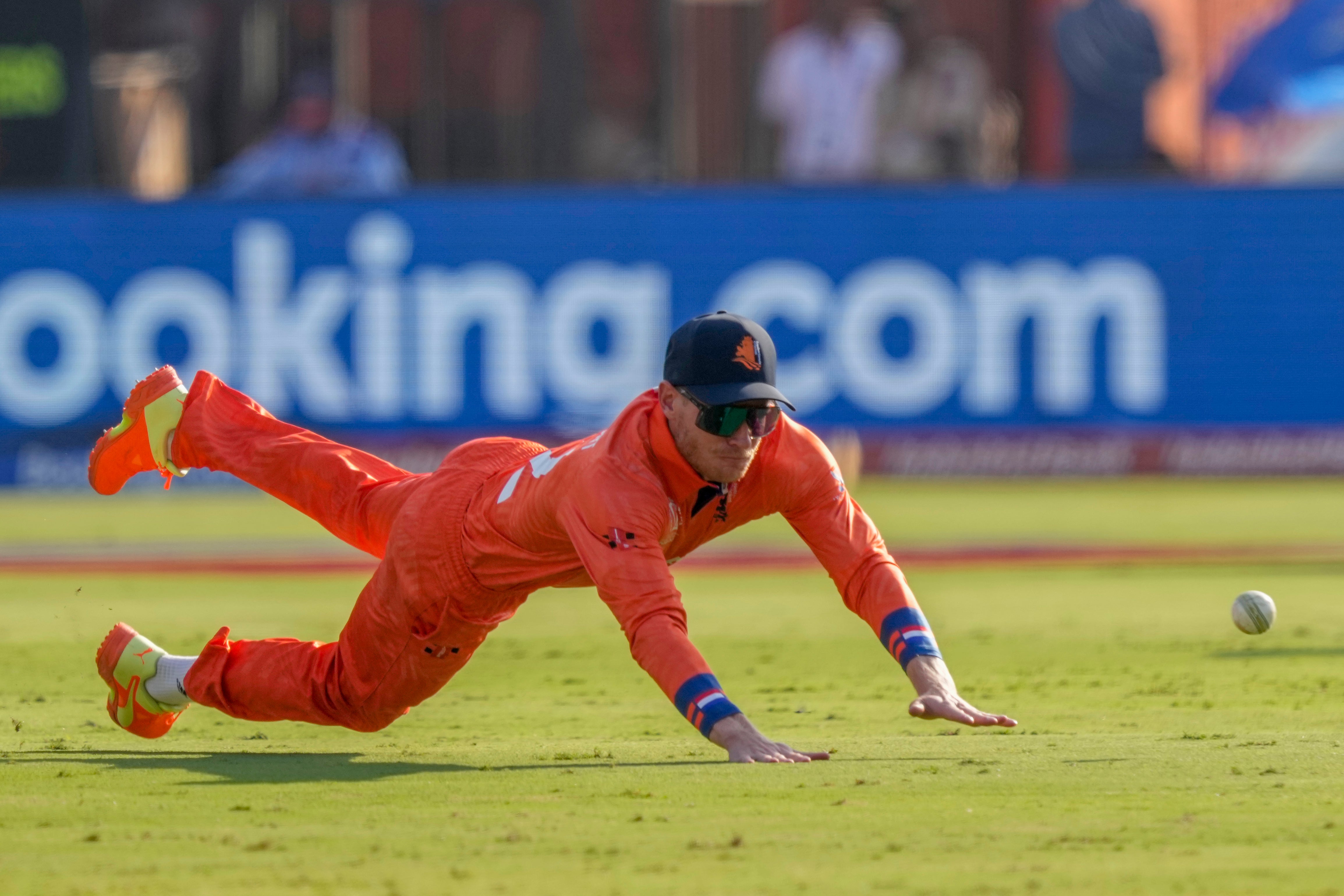 Netherlands’ Sybrand Engelbrecht dives to field a ball during the ICC Men’s Cricket World Cup match between Pakistan and Netherlands in Hyderabad