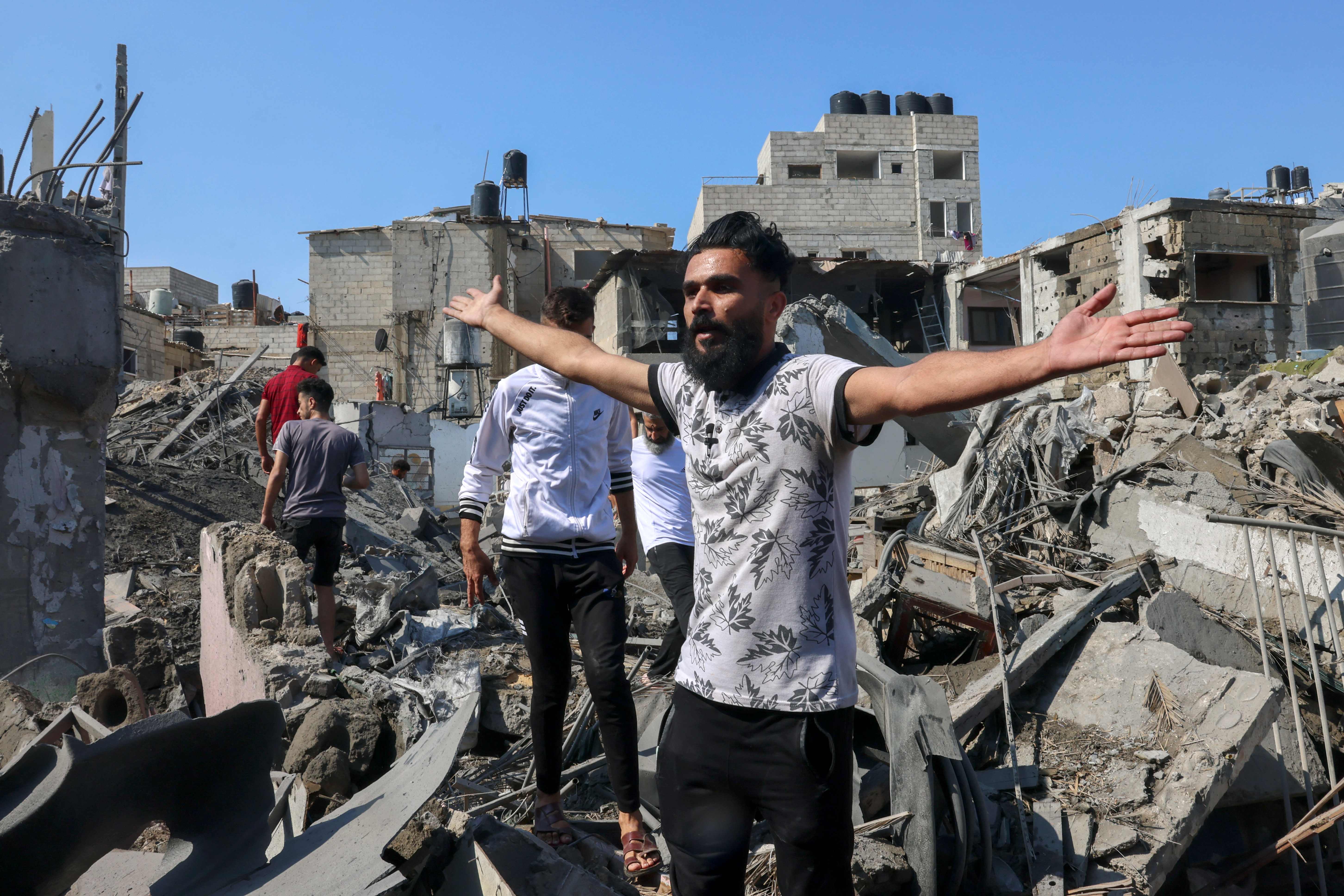 Civilians search for survivors after an Israeli air strike in Rafah in the southern Gaza Strip