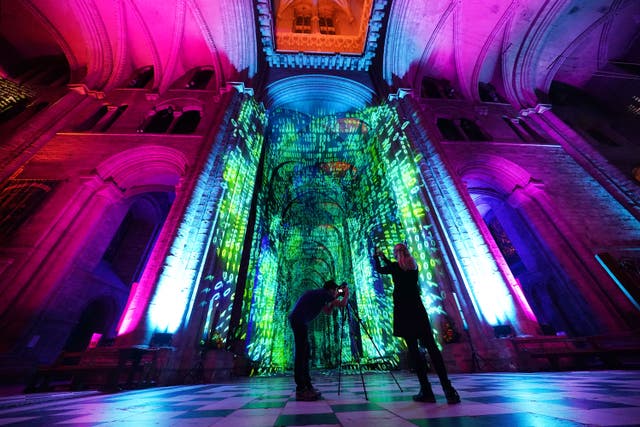 Durham Cathedral has been transformed for the new sound and light show inspired by science (Owen Humphreys/PA)