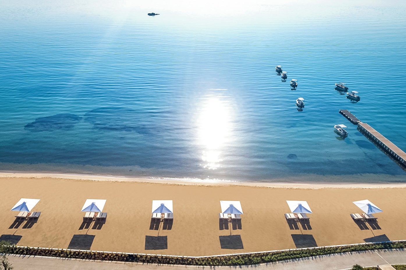 Discover beach perfection around Greece’s incredible coastline, such as the spectacular Ikos Dassia resort in Corfu