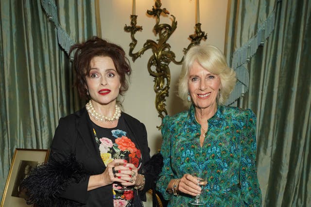 Camilla (right) and Helena Bonham Carter had a lengthy chat at the reception (Yui Mok/PA)