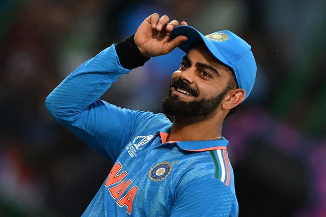 <p>Virat Kohli gestures to spectators during the 2023 ICC Men’s Cricket World Cup one-day international (ODI) match between India and Afghanistan at the Arun Jaitley Stadium in New Delhi on 11 October</p>
