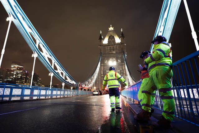 Engineers work at Tower Bridge in central London (James Manning/PA)