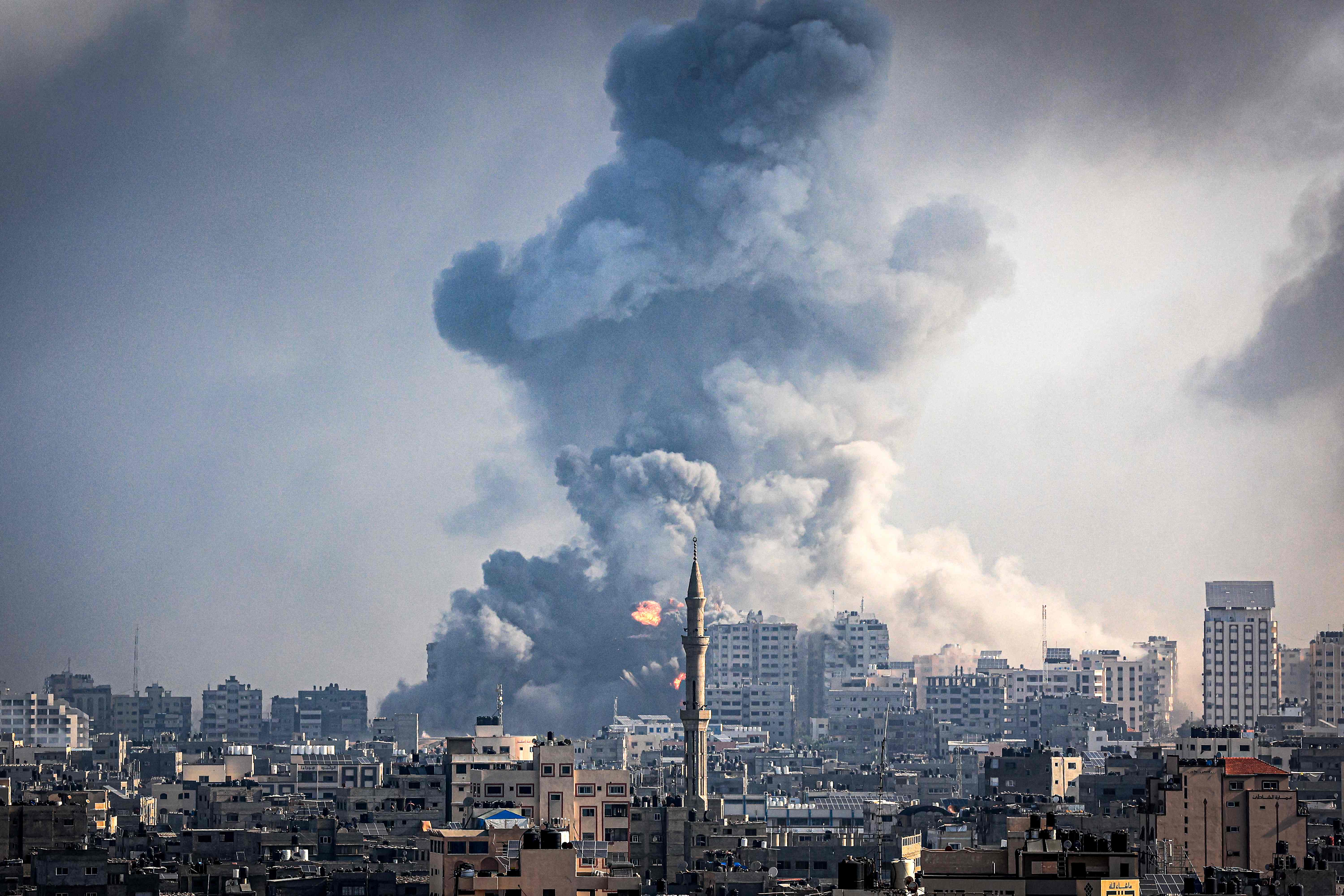 Smoke plumes billow during Israeli air strikes in Gaza City