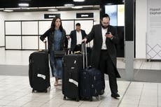 Emotional travellers arriving in UK describe Hamas rocket attacks