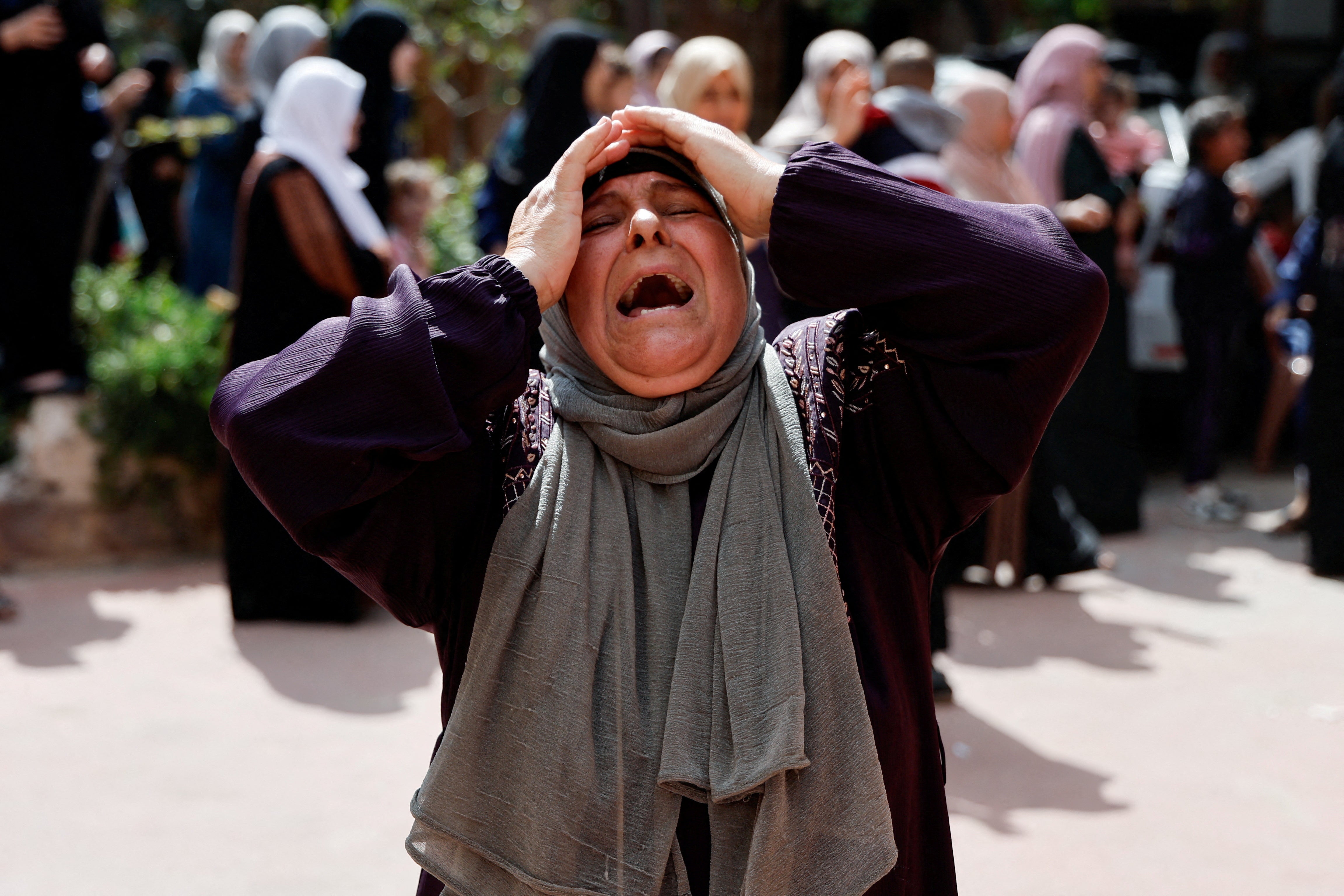 Mourners attend the funeral of four Palestinians killed in clashes with Israeli settlers, near Nablus in the Israeli-occupied West Bank