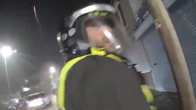<p>Fireworks thrown at police as bodycam footage shows night of terror as detectives hunt teen’s killer a year on.</p>
