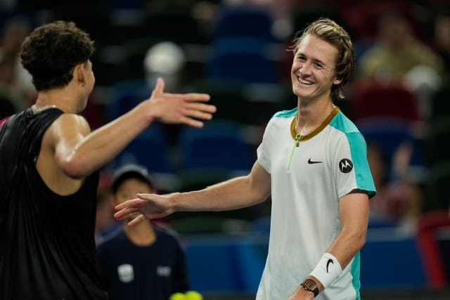 Sebastian Korda, right, shakes hands with Ben Shelton at the end of their memorable quarter-final (Andy Wong/AP)