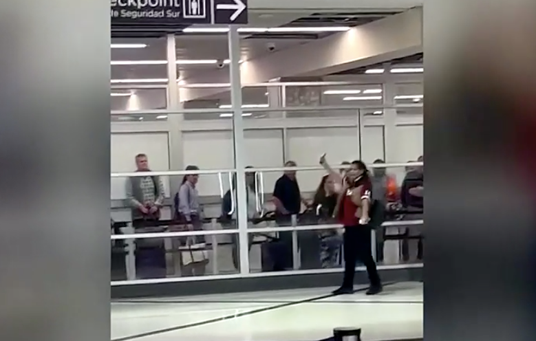 A woman was arrested after stabbing three people at an Atlanta airport