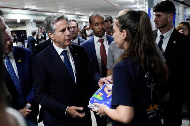 <p>US Secretary of State Antony Blinken speaks with Tal Ben-Chorin, a dual U.S.-Israeli citizen, as he visits a donation center for victims of the Hamas terror attacks, Thursday Oct. 12, 2023, in Tel Aviv. </p>