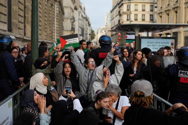 <p>Protestors chant slogans during a rally in solidarity with the Palestinian people in Gaza, in Paris on 12 October </p>