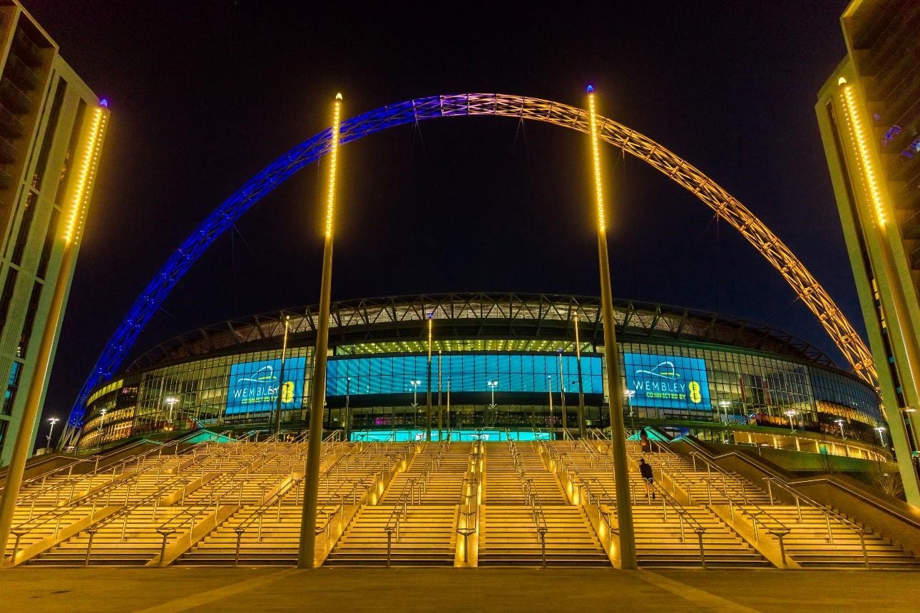 Wembley Stadium’s arch was lit in yellow and blue in an expression of solidarity with Ukraine following Russia’s invasion. (Amanda Rose/Wembley Park/PA)