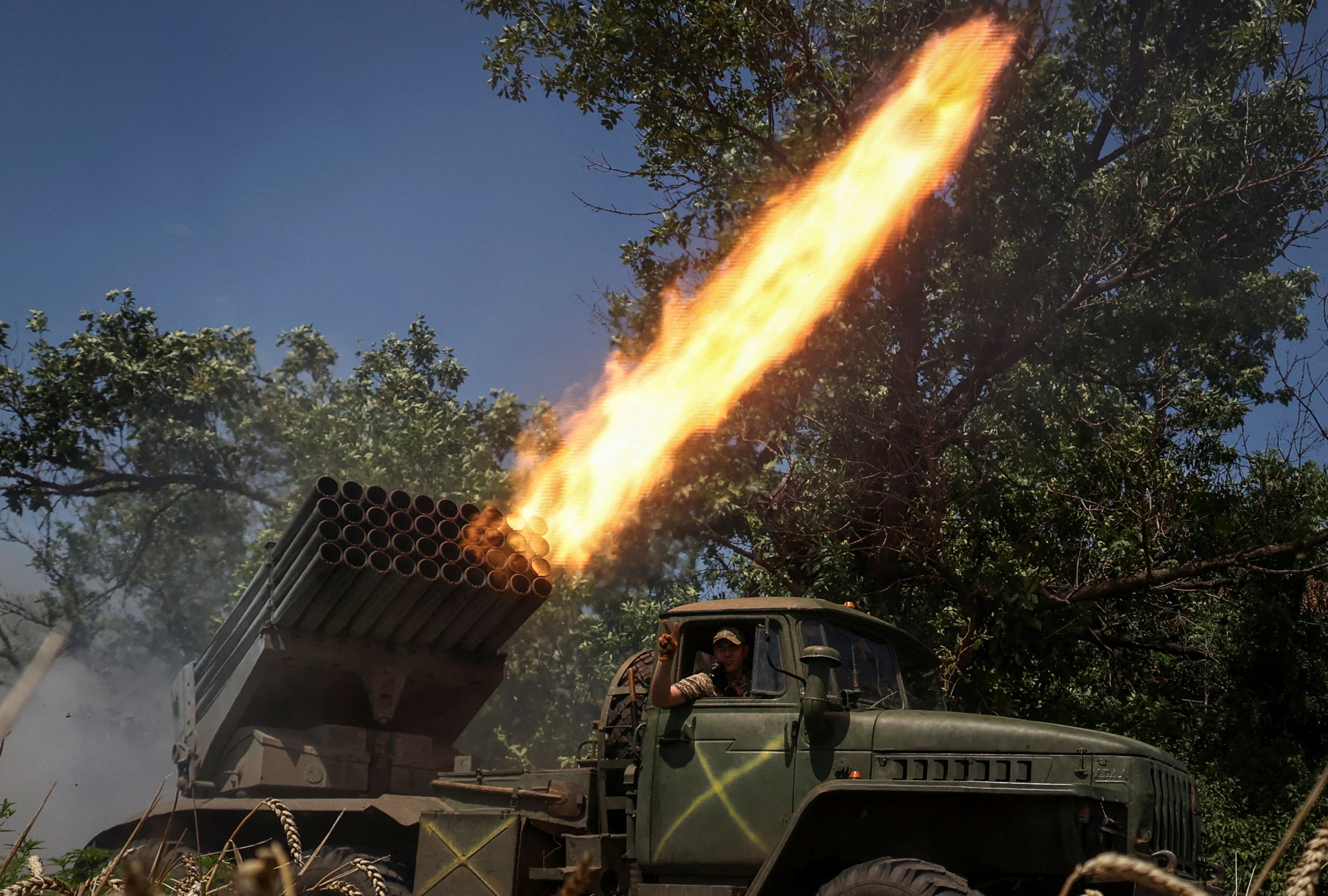 Ukrainian servicemen of the 59th Separate Motorised Infantry Brigade fire a BM-21 Grad multiple launch rocket system towards Russian troops near a front line, amid Russia’s attack on Ukraine, near the town of Avdiivka, in the Donetsk region