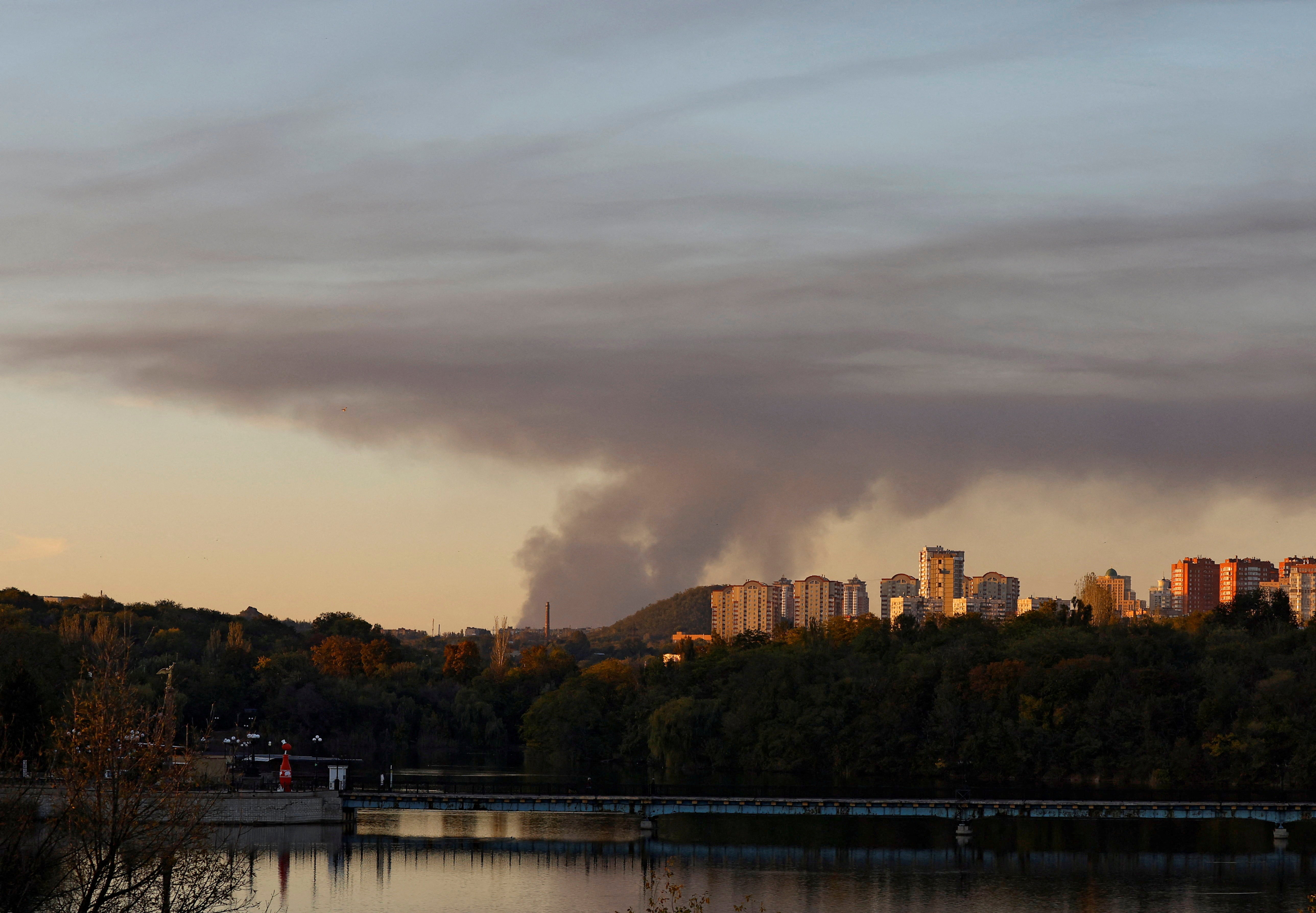 Smoke rises from an area in the direction of Avdiivka, as seen from Donetsk, on 11 October
