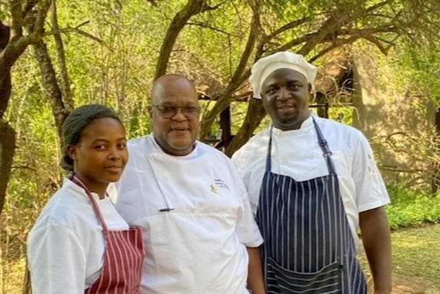 <p>Group executive chef Wilfred Mtshali (centre) with Dzunisani Lubisi, trainee chef (left) and Freedom Masinga, former trainee chef and chef de partie at Little Bush Camp</p>