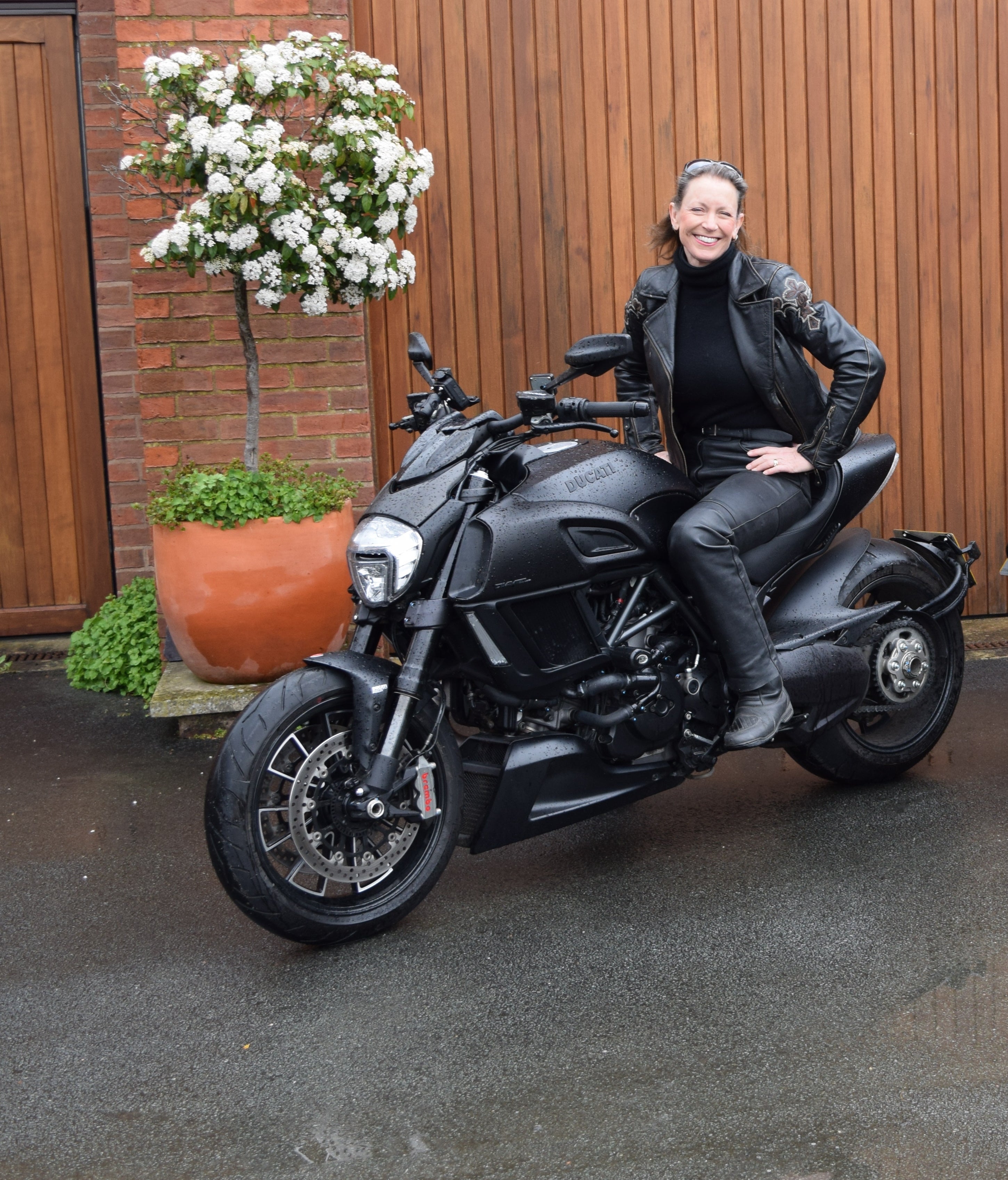 Frieda and her beloved Ducati Diavel – one of several motorbikes in her stable