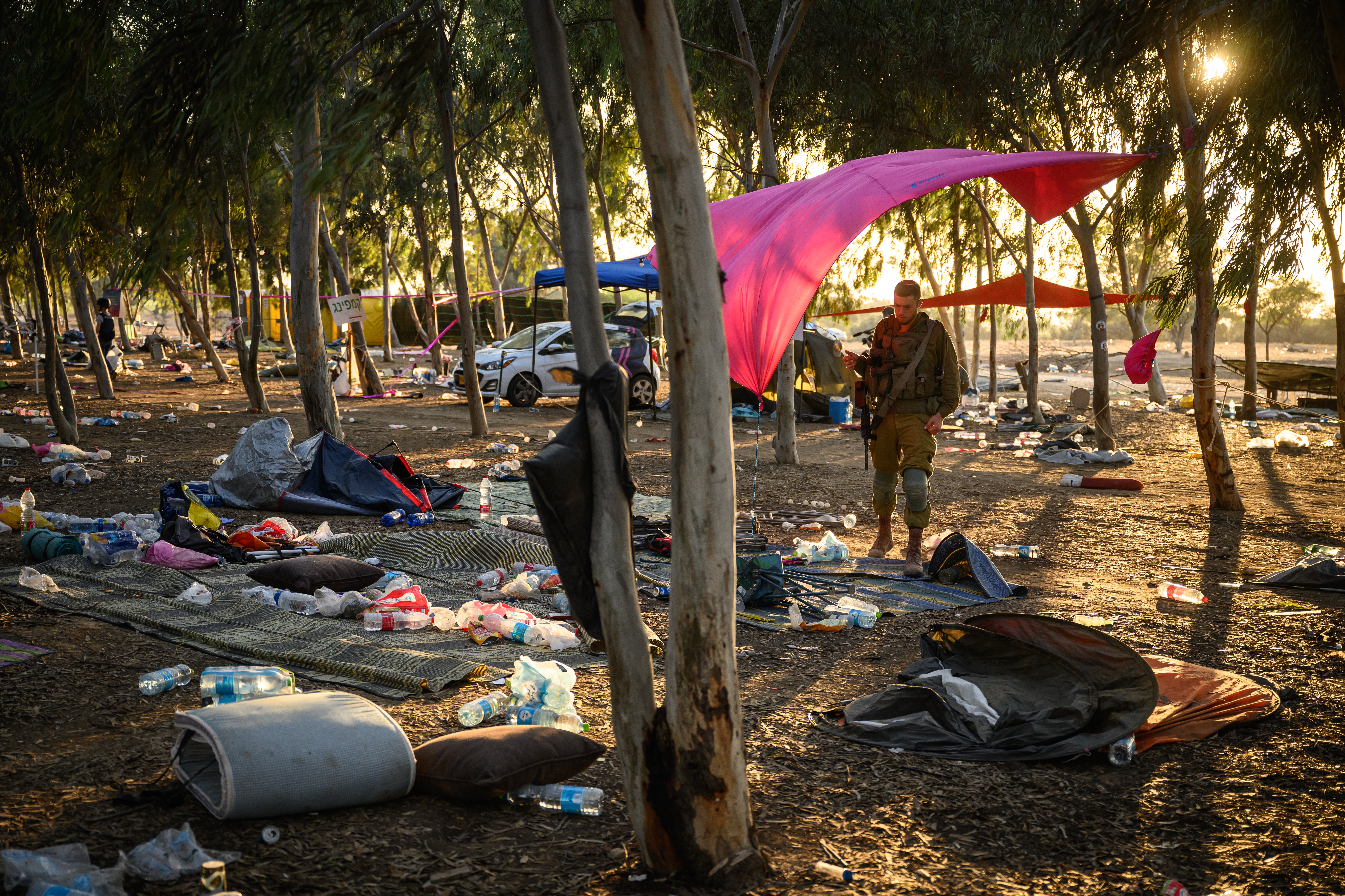 Search at the Israel festival site for survivors and personal effects