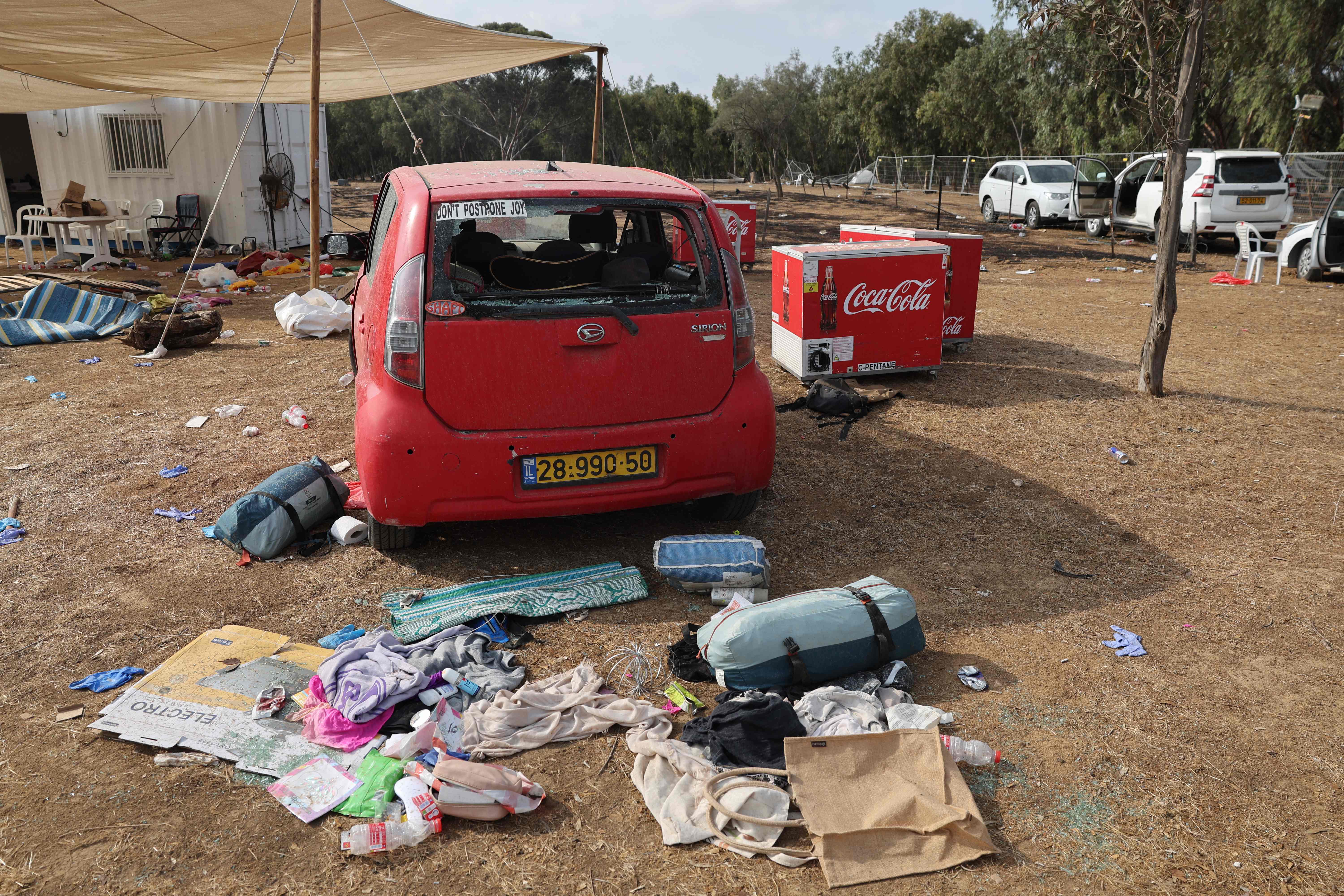 Festival goers’ possessions are strewn across the floor, showing the sudden shock of the Hamas attack on the music festival