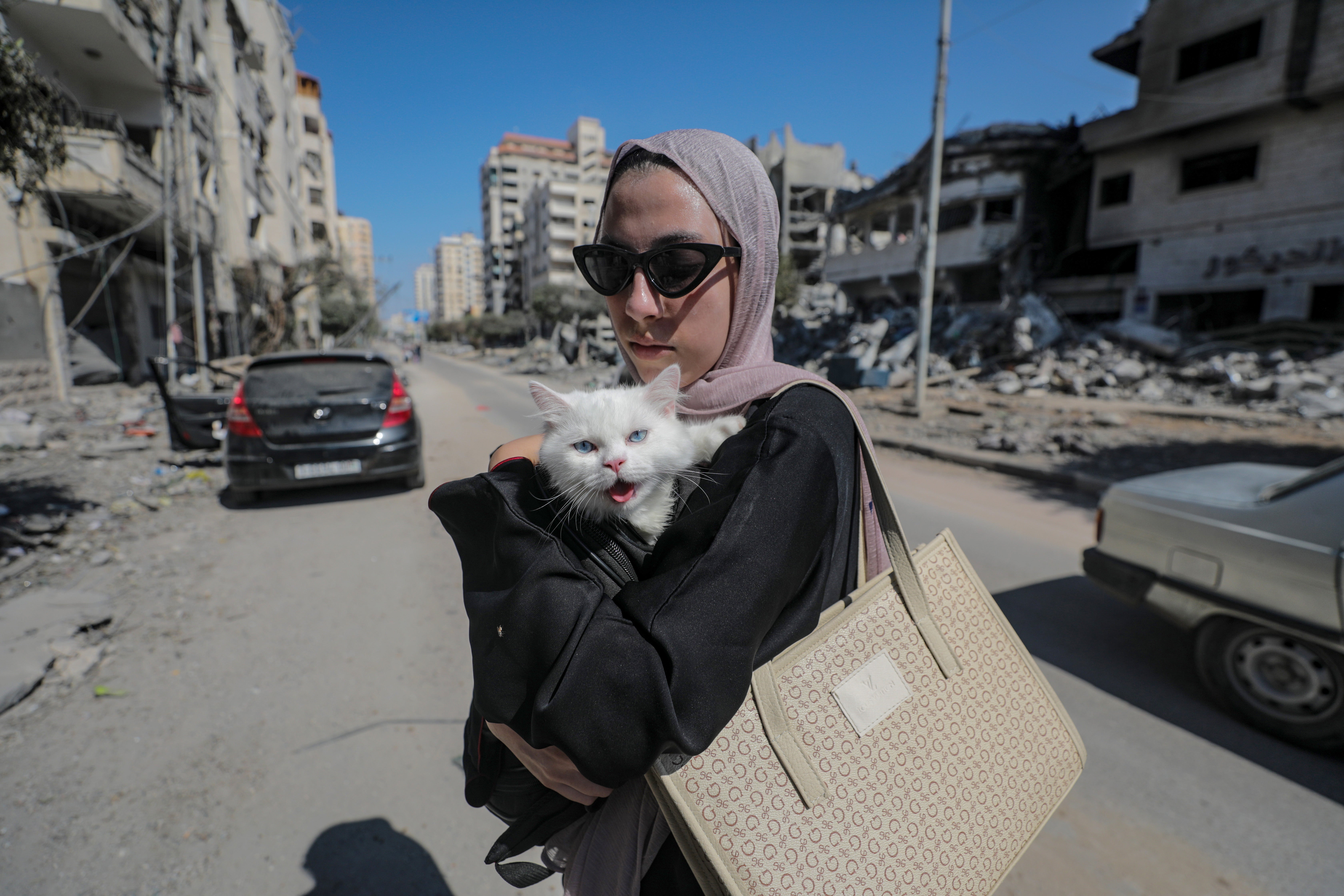 A resident of Gaza City prepares to evacuate following an Israeli warning of increased military operations
