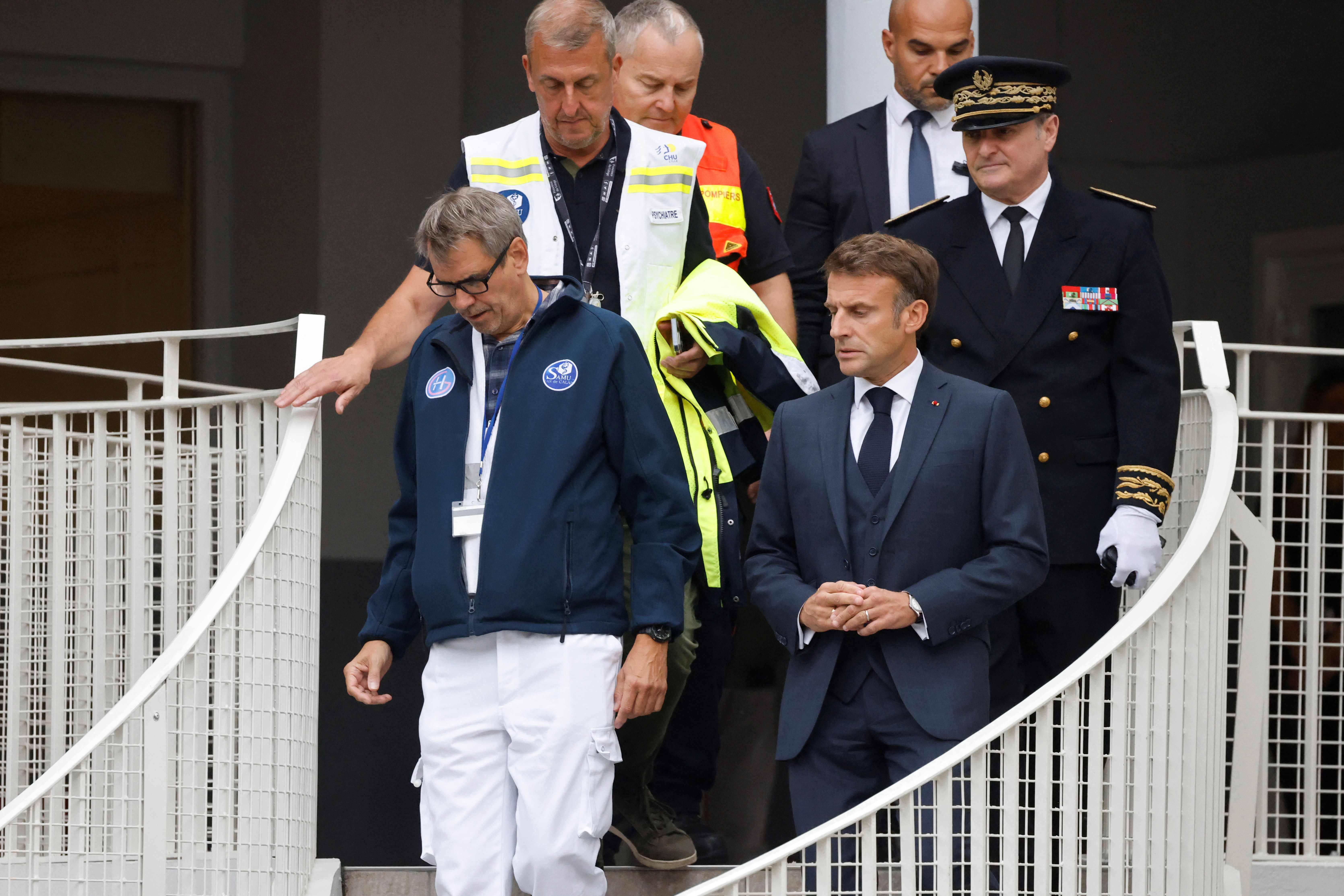 Emmanuel Macron, followed by Pas-de-Calais Prefect Jacques Billant visit the Gambetta high school in Arras