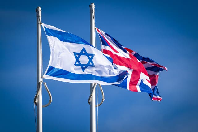 The flag of Israel and the Union flag above the UK Government Queen Elizabeth House building in Edinburgh (Jane Barlow/PA)