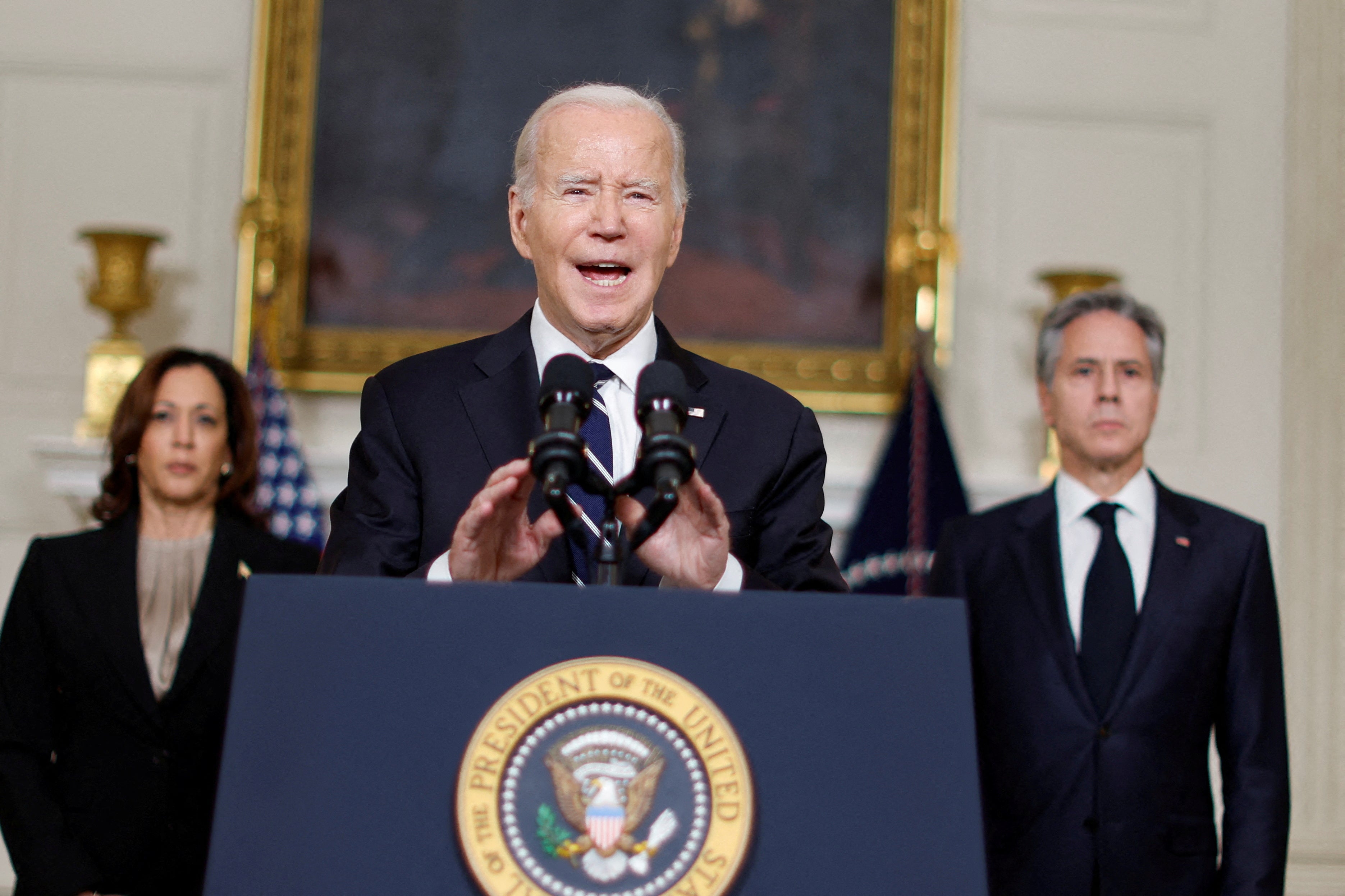 U.S. President Joe Biden, accompanied by Vice President Kamala Harris and U.S. Secretary of State Antony Blinken, makes remarks after speaking by phone with Israeli Prime Minister Benjamin Netanyahu about the situation in Israel following Hamas’ deadly attacks, from the State Dining Room at the White House in Washington, U.S. October 10, 2023.