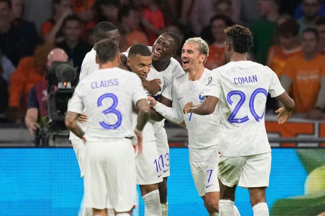 Kylian Mbappe, centre left, celebrates after scoring France’s second goal against the Netherlands (Peter Dejong/AP)