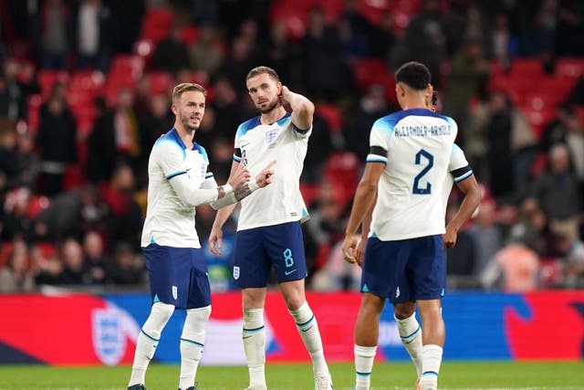 <p>Jordan Henderson (centre) was booed by some England fans (PA)</p>