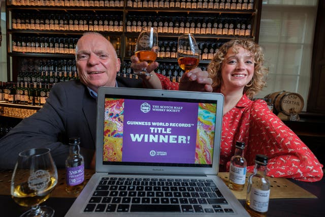 John McCheyne, and Madeleine Schmoll of the Scotch Malt Whisky Society who broke a world record for the largest online whisky tasting event (Mike Wilkinson/PA)