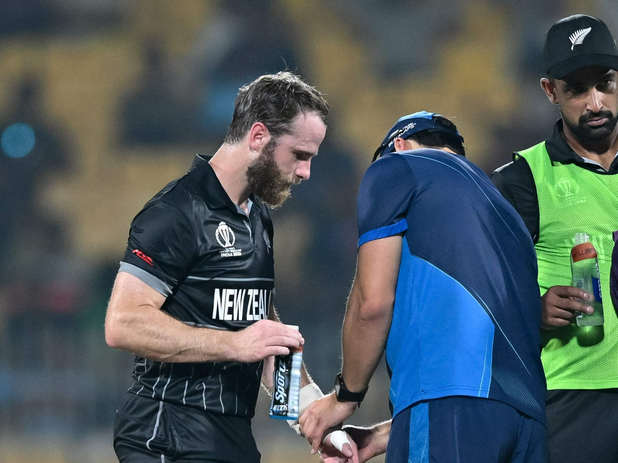 New Zealand’s captain Kane Williamson is being helped by a medic
