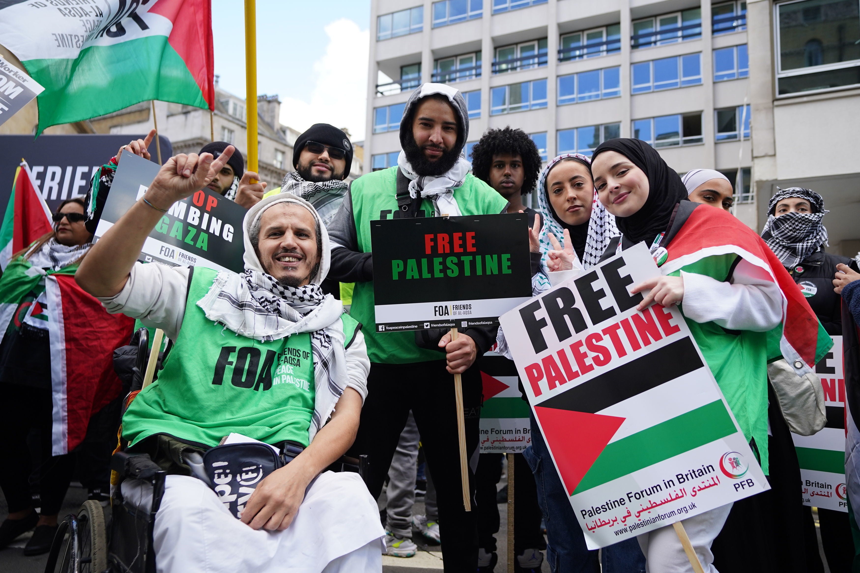 Protesters holding Free Palestine placards during a March for Palestine rally in London