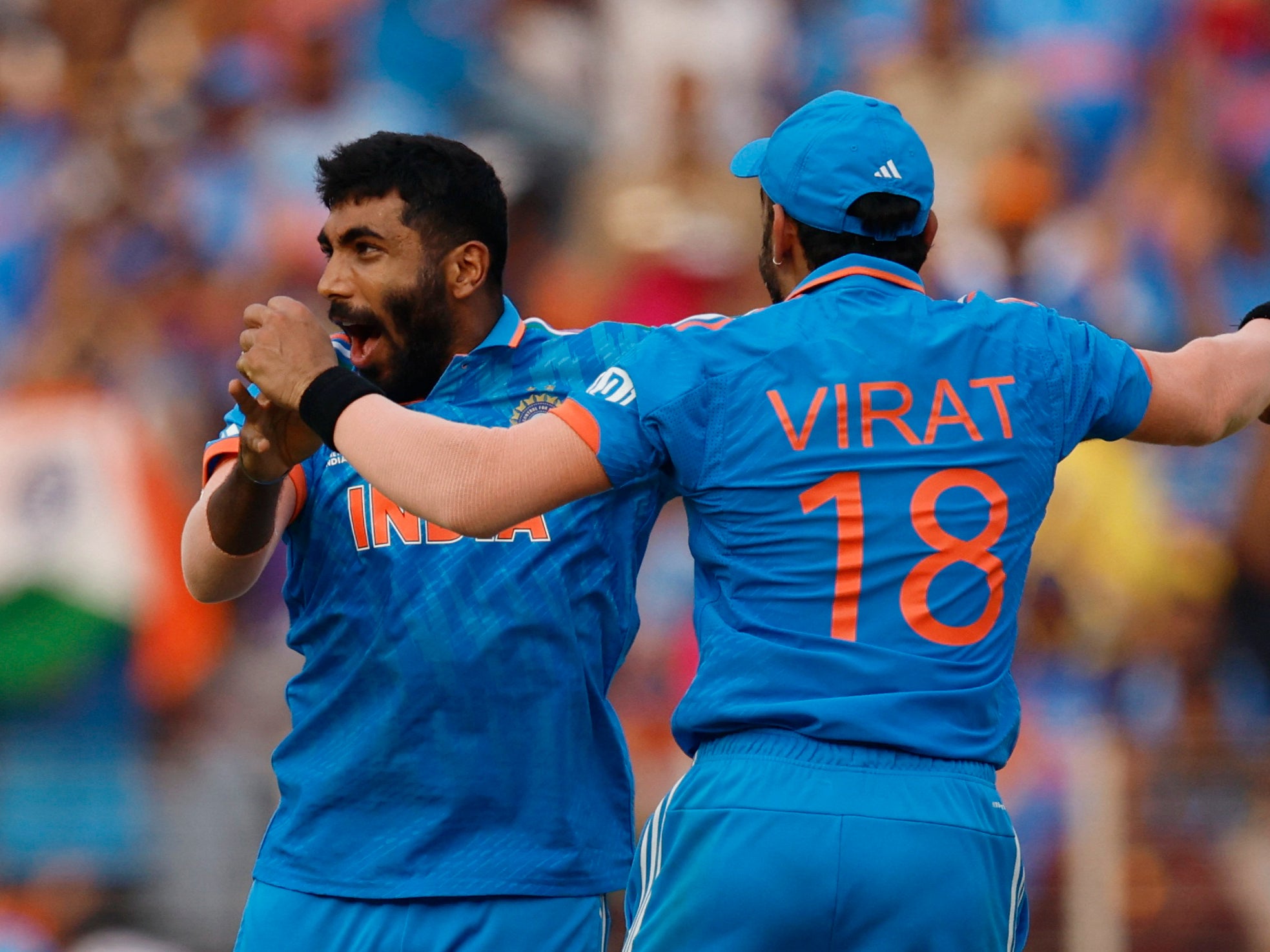 India's Jasprit Bumrah celebrates with Virat Kohli