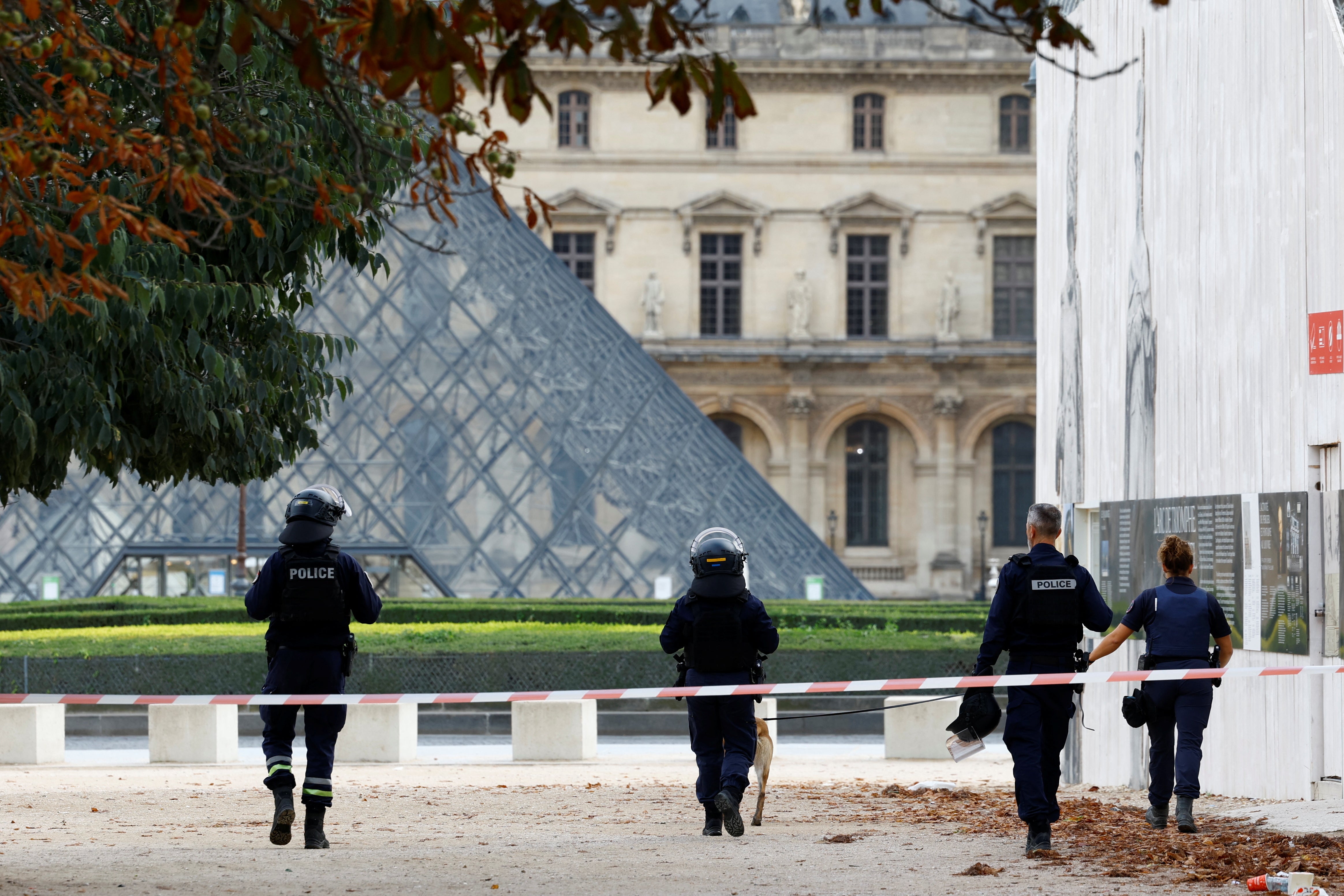 Police patrol in front of the Louvre museum on Saturday