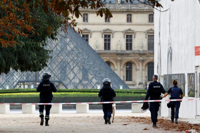 <p>Police patrol in front of the Louvre museum on Saturday </p>