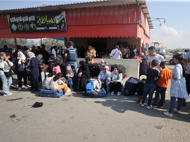 <p>Gazans with foreign passports wait arrive the Rafah Border Gate and wait to cross into Egypt as Israel's attacks on the Gaza Strip continue on the eighth day in Rafah, Gaza on October 14, 2023</p>