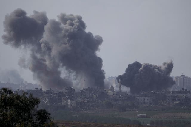 Smoke rises following an Israeli airstrike in the Gaza Strip (Leo Correa/PA)