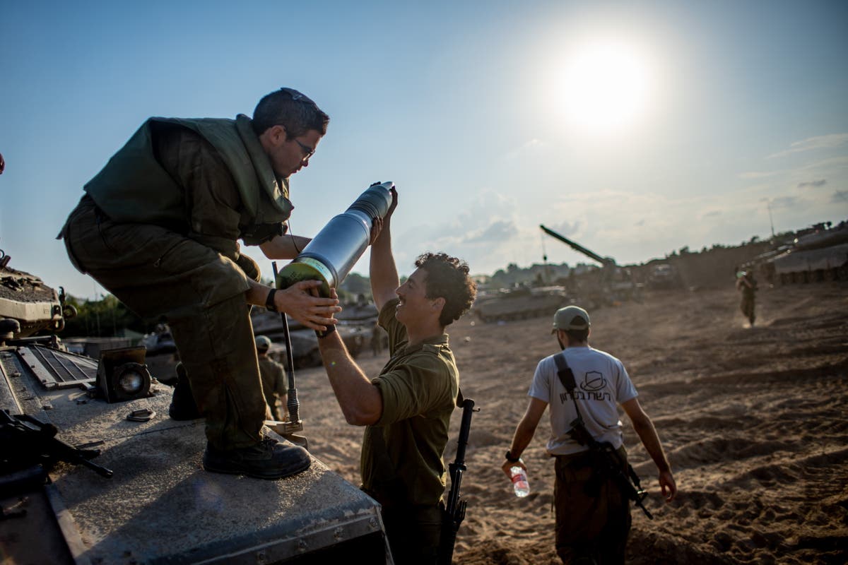 Israelis and Palestinians stare death in the face as they wait for the invasion 