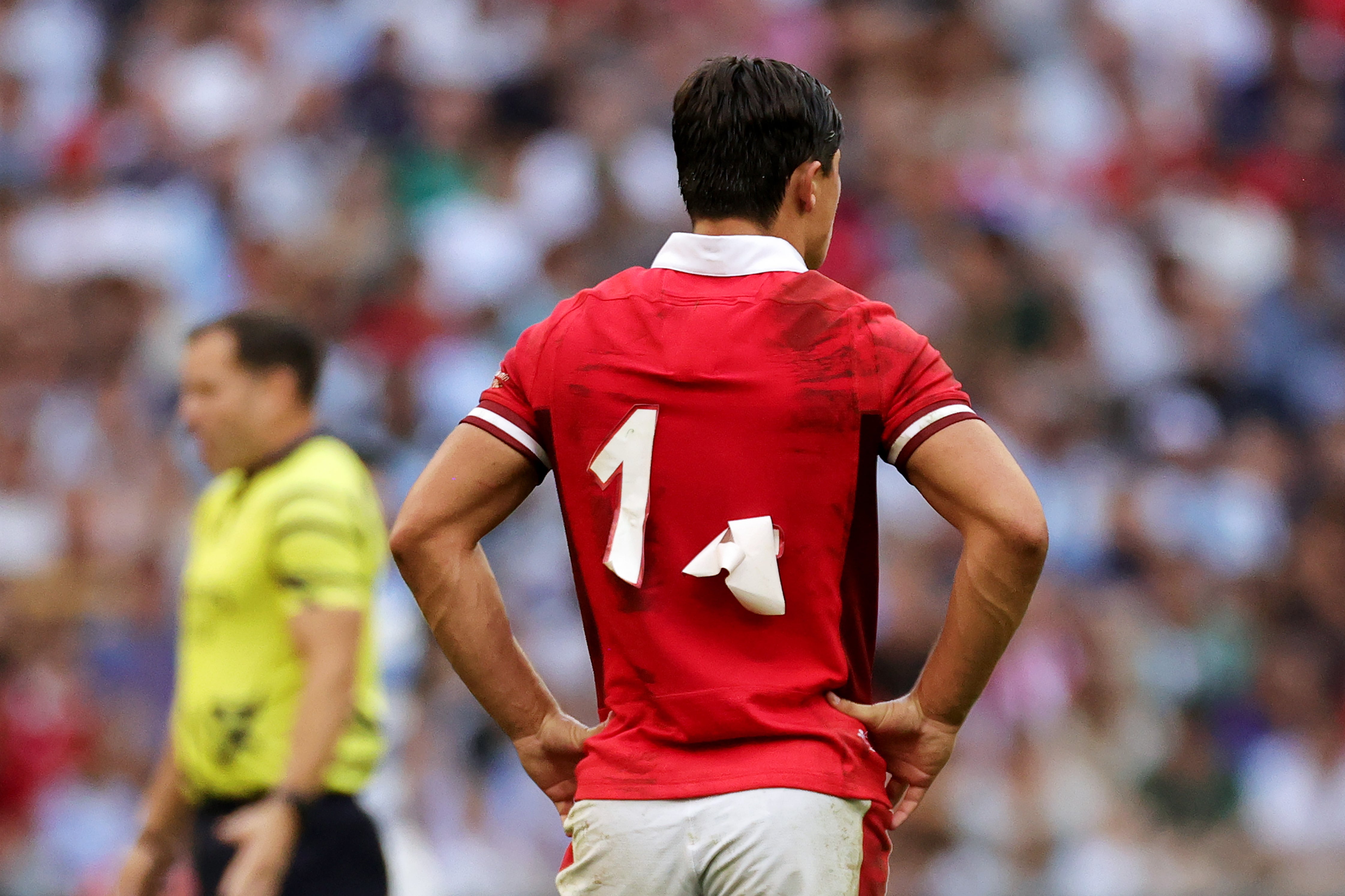 The numbers of the Welsh players peeled off the back of their shirts in a bizarre first quarter