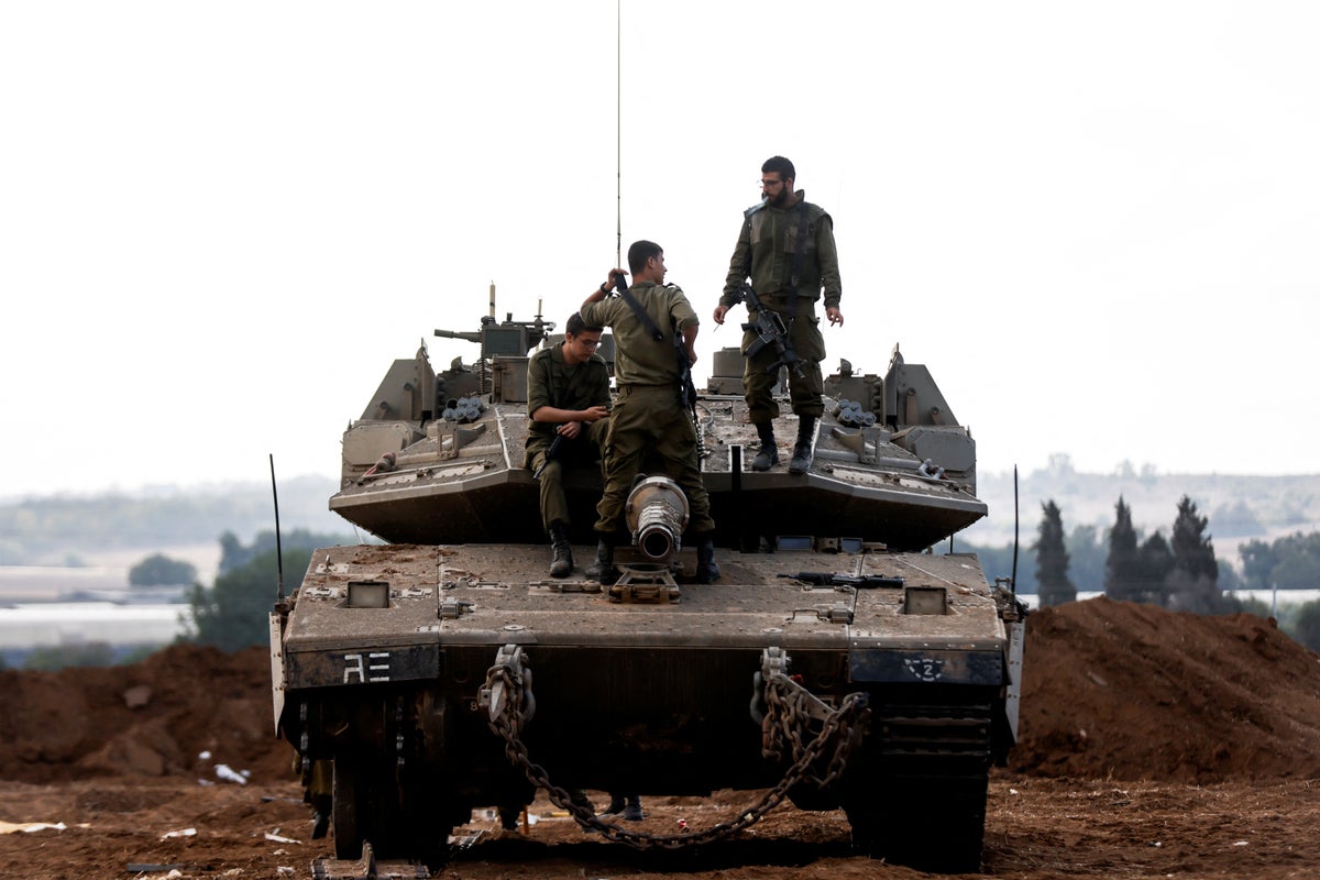 Israel-Hamas war – live: Netanyahu targets ‘bloodthirsty monsters’ as tanks mass on Gaza border