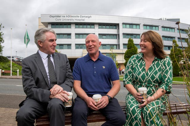 Mark Lang, centre, and his wife Julie met with consultant cardiologist Professor Noel Caplice of Cork University Hospital (Brian Lougheed/PA)