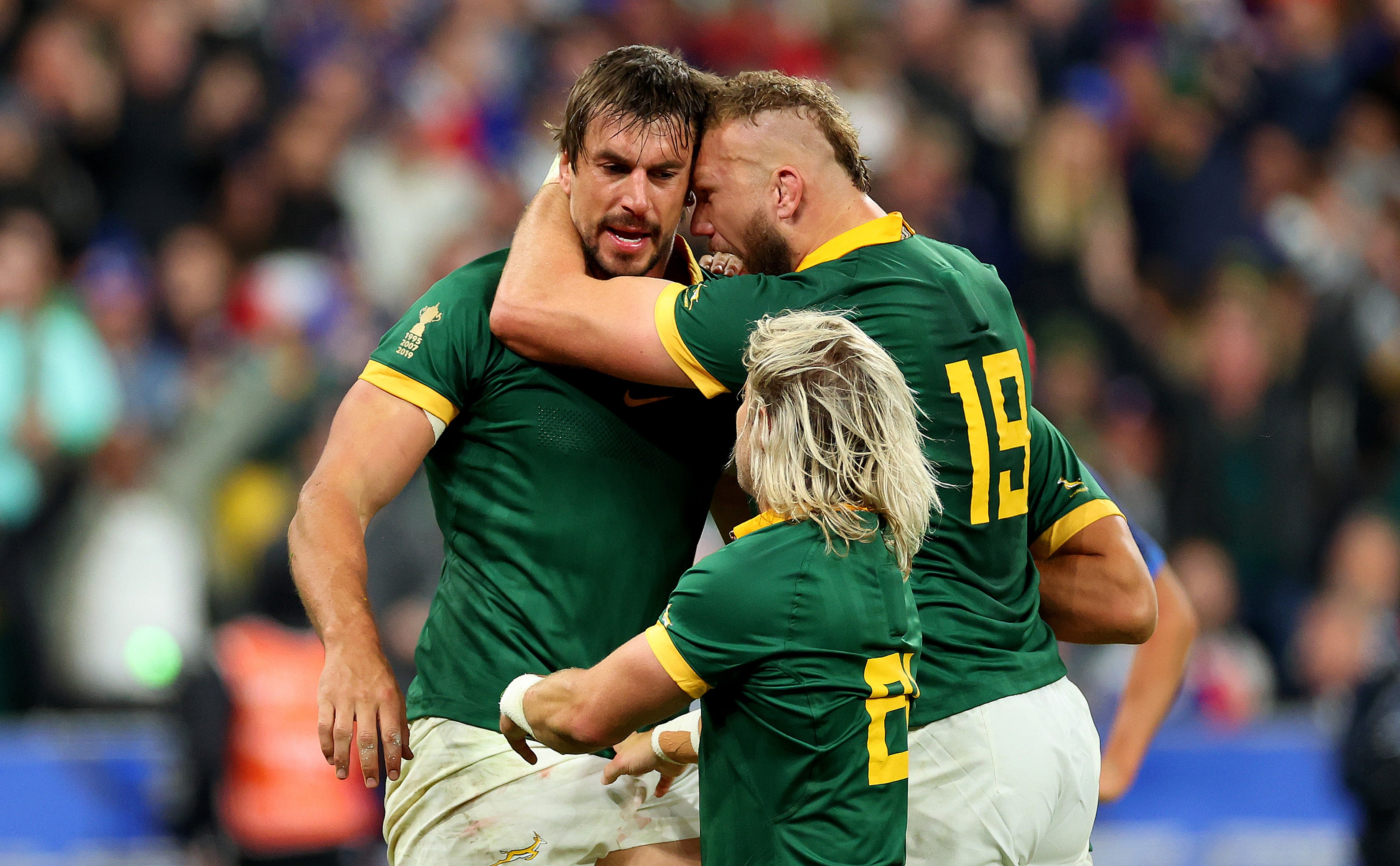 Eben Etzebeth, left, celebrates with RG Snyman and the slightly more diminutive Faf de Klerk