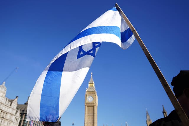 An Israeli flag at a vigil at Parliament Square in London, for victims and hostages of the Hamas attacks (James Manning/PA)