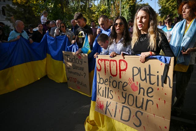 <p>Ukrainian war refugees protest with placards in front of Russia’s embassy to Romania in Bucharest</p>