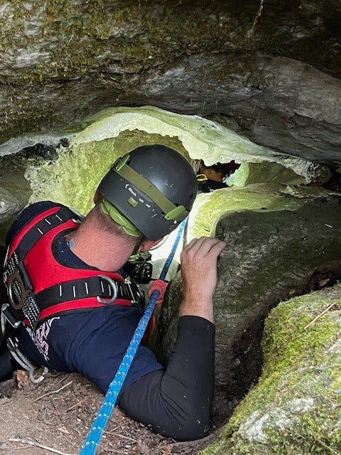 A 200-pound bear suprised the rescue team, who had to retreat after encountering the sleeping beast
