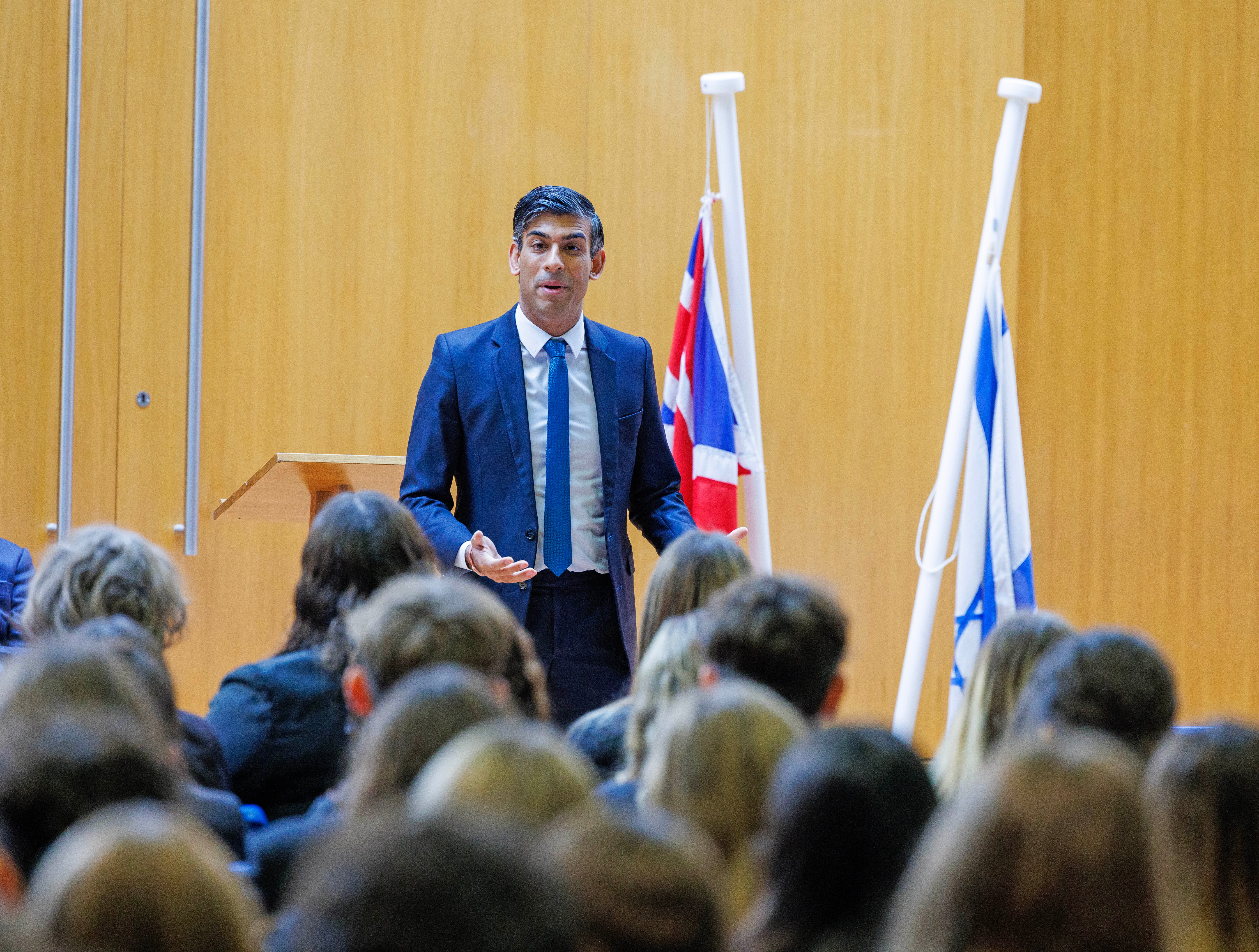 Rishi Sunak addresses students during an assembly at a Jewish school in north London on Monday