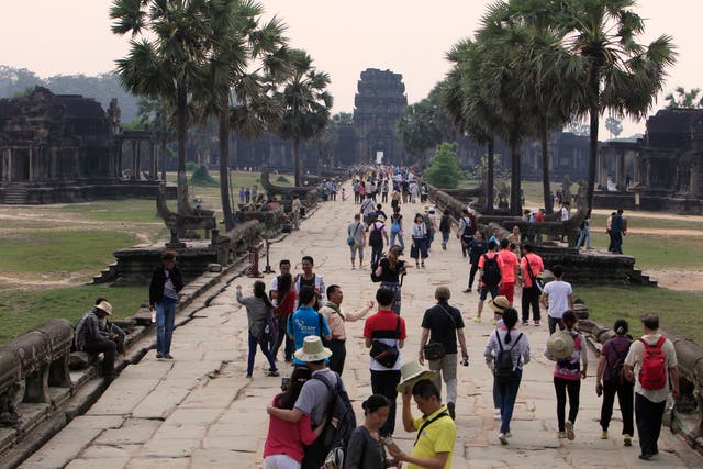 <p>Tourists visit the Angkor Wat temple in Siem Reap, Cambodia</p>