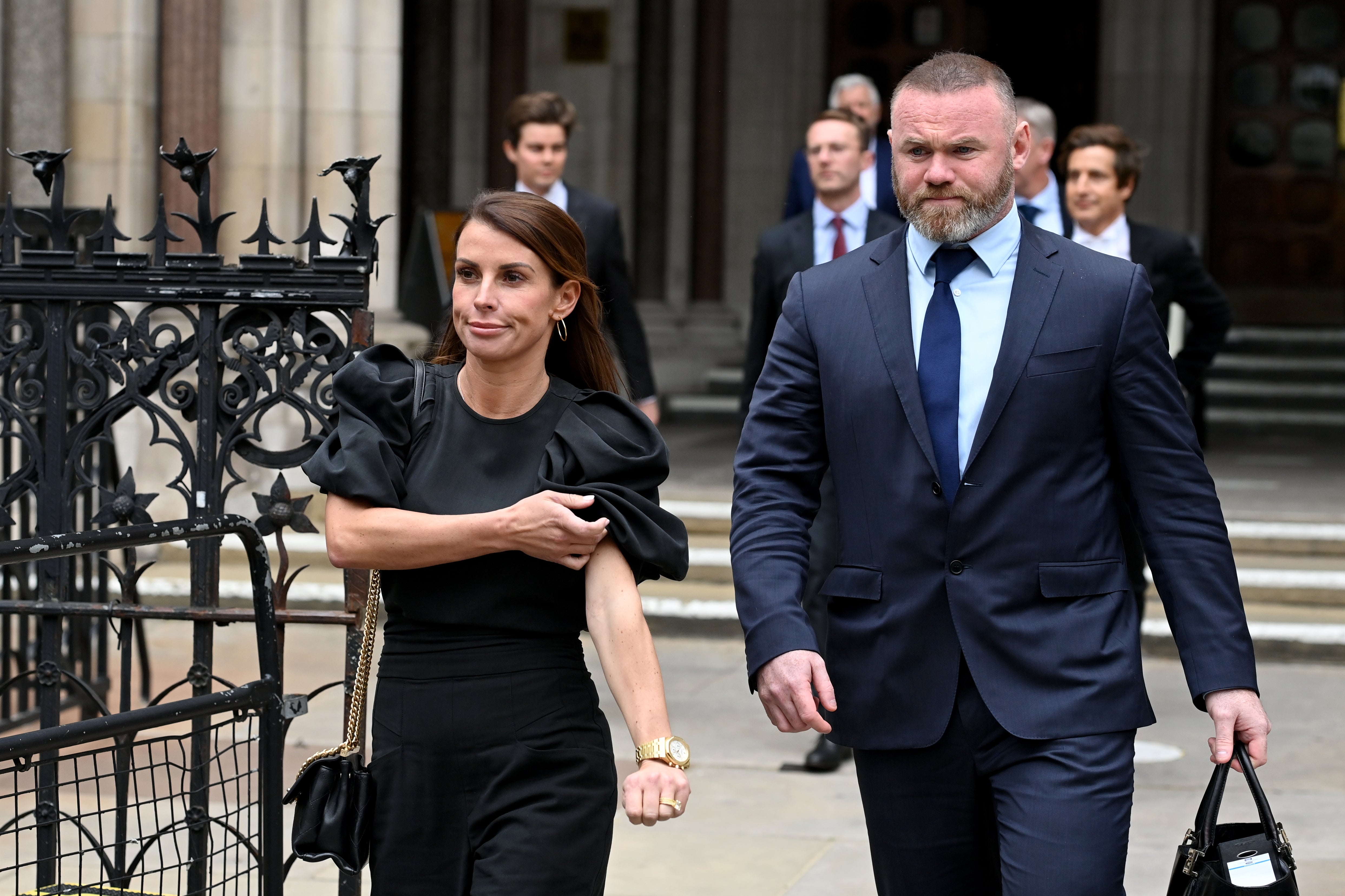 Coleen and Wayne Rooney arriving in court for the trial last year